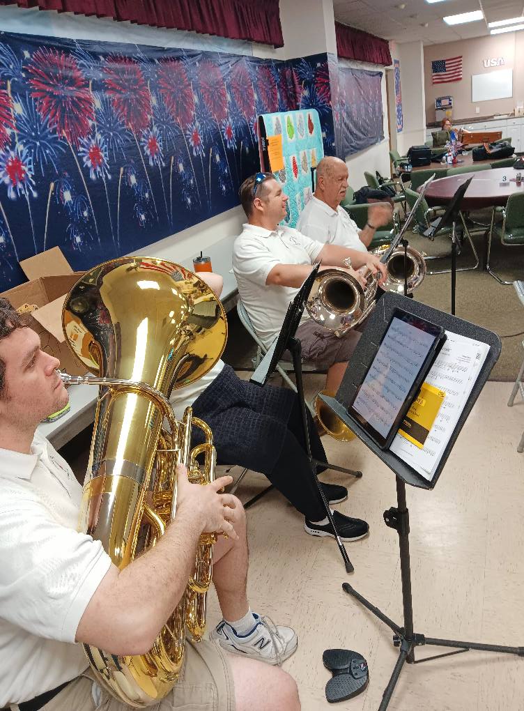 Inner Tuba performing with brass band or ensemble